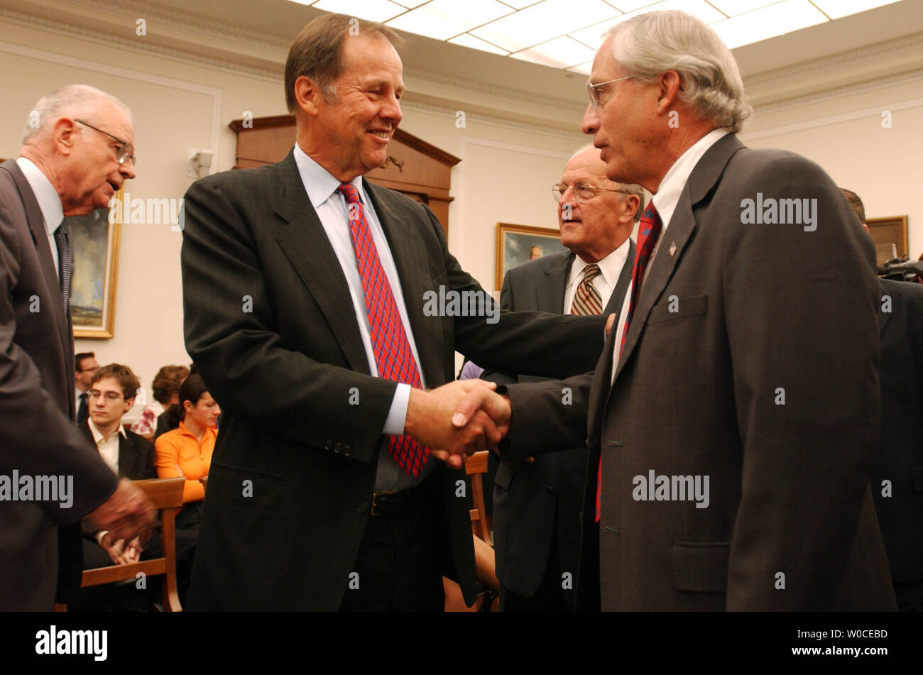 Newly nominated Director of the CIA Rep. Porter Goss, R-FL, greets 9/11 Commission Chairman Thomas Kean prior to a Full House Intelligence Committee hearing on August 11, 2004 in Washington.  The committee is examining the 9/11 Committee's recommendation to create an intelligence chief to over see all of America's intelligence services.   (UPI Photo/Michael Kleinfeld) Stock Photo