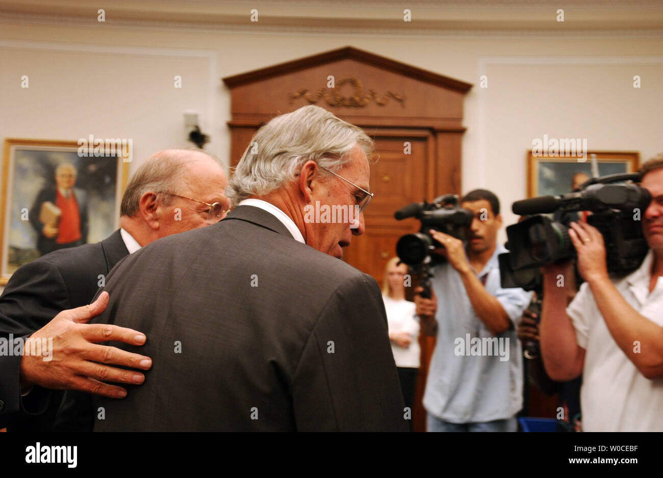 Newly nominated Director of the CIA Rep. Porter Goss, R-FL, is escorted by Rep. Sherwood Boehlert, R-NY,  prior to a Full House Intelligence Committee hearing on August 11, 2004 in Washington.  The committee is examining the 9/11 Committee's recommendation to create an intelligence chief to over see all of America's intelligence services.   (UPI Photo/Michael Kleinfeld) Stock Photo