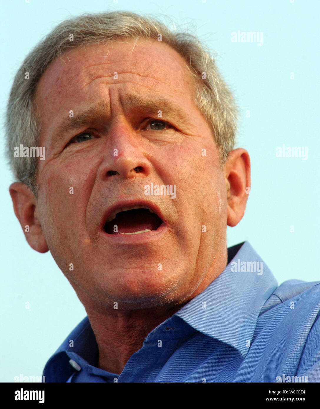 President George W. Bush speaks to those gathered at a campaign stop in Hedgesville, West Virginia on August 17, 2004.  The President said that if elected, the U.S. economy would improve, the U.S. would win the war on terrorism, and that he help bring compassion back to the country. (UPI Photo/Michael Kleinfeld) Stock Photo