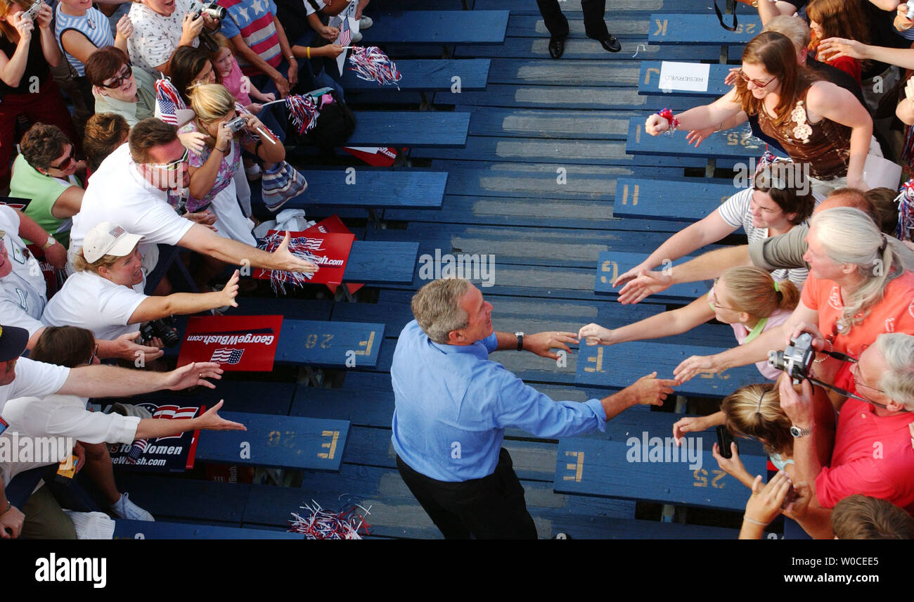 President George W. Bush greets those gathered at a campaign stop in Hedgesville, West Virginia on August 17, 2004.  The President said that if elected, the U.S. economy would improve, the U.S. would win the war on terrorism, and that he help bring compassion back to the country. (UPI Photo/Michael Kleinfeld) Stock Photo