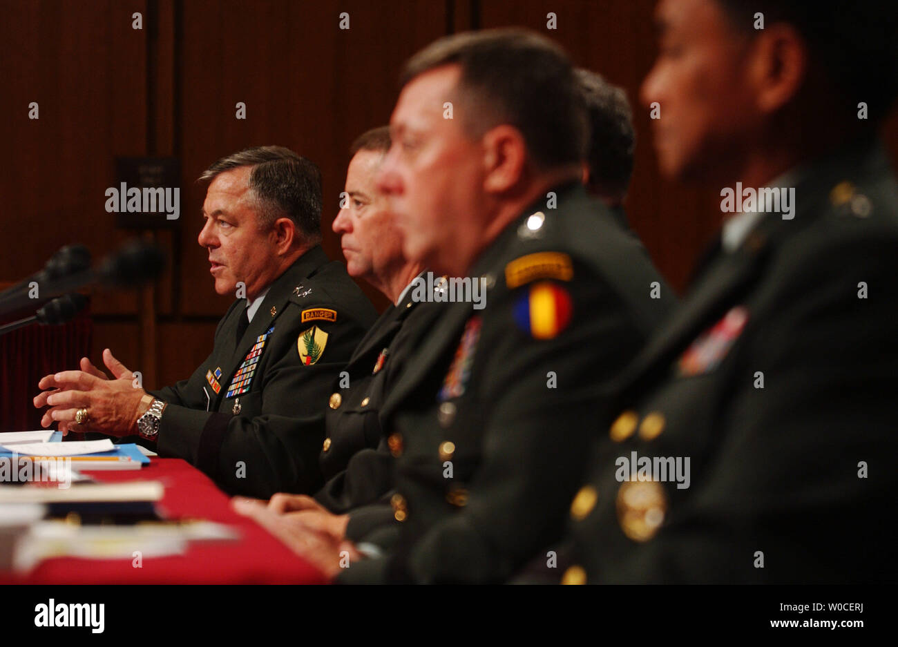 Maj. Gen. Steven Whitcomb testifies before the Senate Armed Service Committee regarding the abuses of the 205th Military Intelligence Brigade at Abu Ghraib Prison, Iraq.  He said that mistakes were made because of a shortage of soldiers and general chaos.   Gen. Paul Kern,  Lt. Gen. Anthony Jones, Maj. Gen. George Fay, and Maj. Gen. Antonio Tagubal look on. (UPI Photo/Michael Kleinfeld) Stock Photo