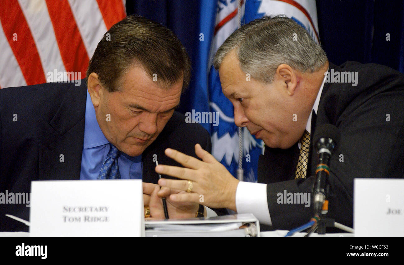 Secretary of Homeland Security Tom Ridge, left, confers with Chairman Joe Grano during a meeting of the Homeland Security Advisory Committee (HSAC) at the Coast Guard Headquarters in Washington on Sept. 22, 2004. HSAC, a group of public and private officials, meets regulary to discuss security issues and make recommendations.   (UPI Photo/Roger L. Wollenberg) Stock Photo