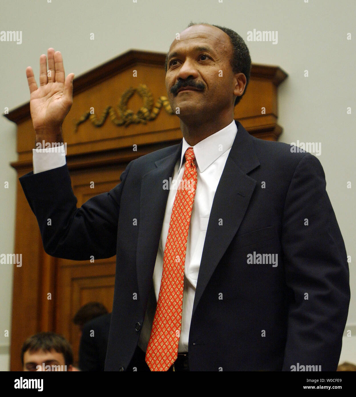 Chairman and Chief Executive Officer of Fannie Mae Franklin Raines is sworn in prior to testifying about a report provided to Congress by Director of the Office of Federal Housing Enterprise Oversight Armando Falcon, entitled 'Allegations of Accounting and Management Failure at Fannie Mae,' at the House Financial Services Committee on  October 6, 2004 in Washington.  The report alleges that Fannie Mae changed its books to the benefit of its management. (UPI Photo/Michael Kleinfeld) Stock Photo