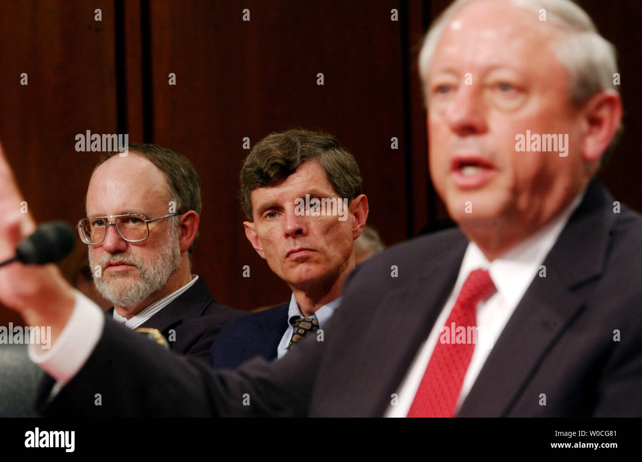 Mr. Raymond V. Gilmartin, Chairman, President & Chief Executive Officer, Merck & Co., Whitehouse Station, NJ testifies before the Senate Finance Committee hearing on FDA, Merck, and Vioxx on November 18, 2004 in Washington as Dr. David J. Graham of the Food and Drug Administration and Dr. Bruce M. Psaty look on.  Vioxx was taken off the market because it was found to raise the risk of heart attacks.   (UPI Photo/Michael Kleinfeld) Stock Photo