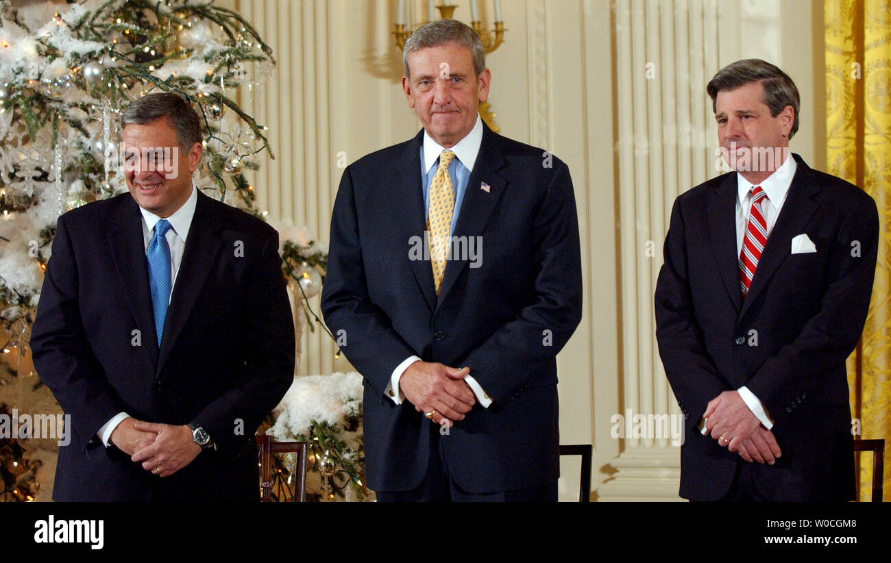 Former CIA Director George Tenet, retired U.S. Gen. Tommy Franks and former Iraq administrator L. Paul Bremer arrive in the East Room of the White House before they are awarded the Presidential Medal of Freedom on Dec. 14, 2004.   (UPI Photo/Roger L. Wollenberg) Stock Photo