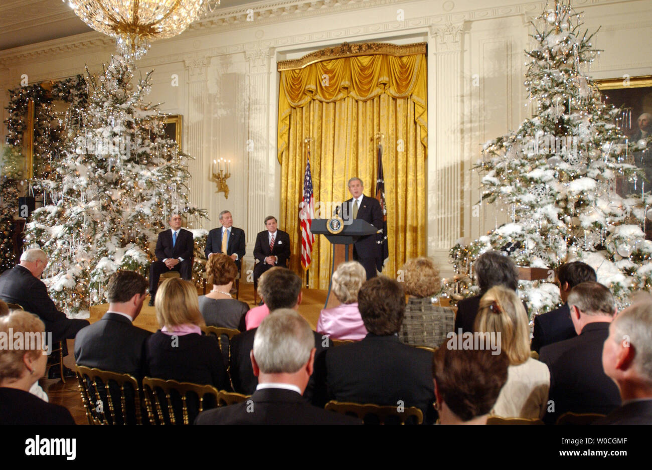 U.S. President George W. Bush speaks to guests during a ceremony to award former CIA Director George Tenet, retired U.S. Gen. Tommy Franks and former Iraq administrator L. Paul Bremer (l to r) the Presidential Medal of Freedom on Dec. 14, 2004.   (UPI Photo/Roger L. Wollenberg) Stock Photo