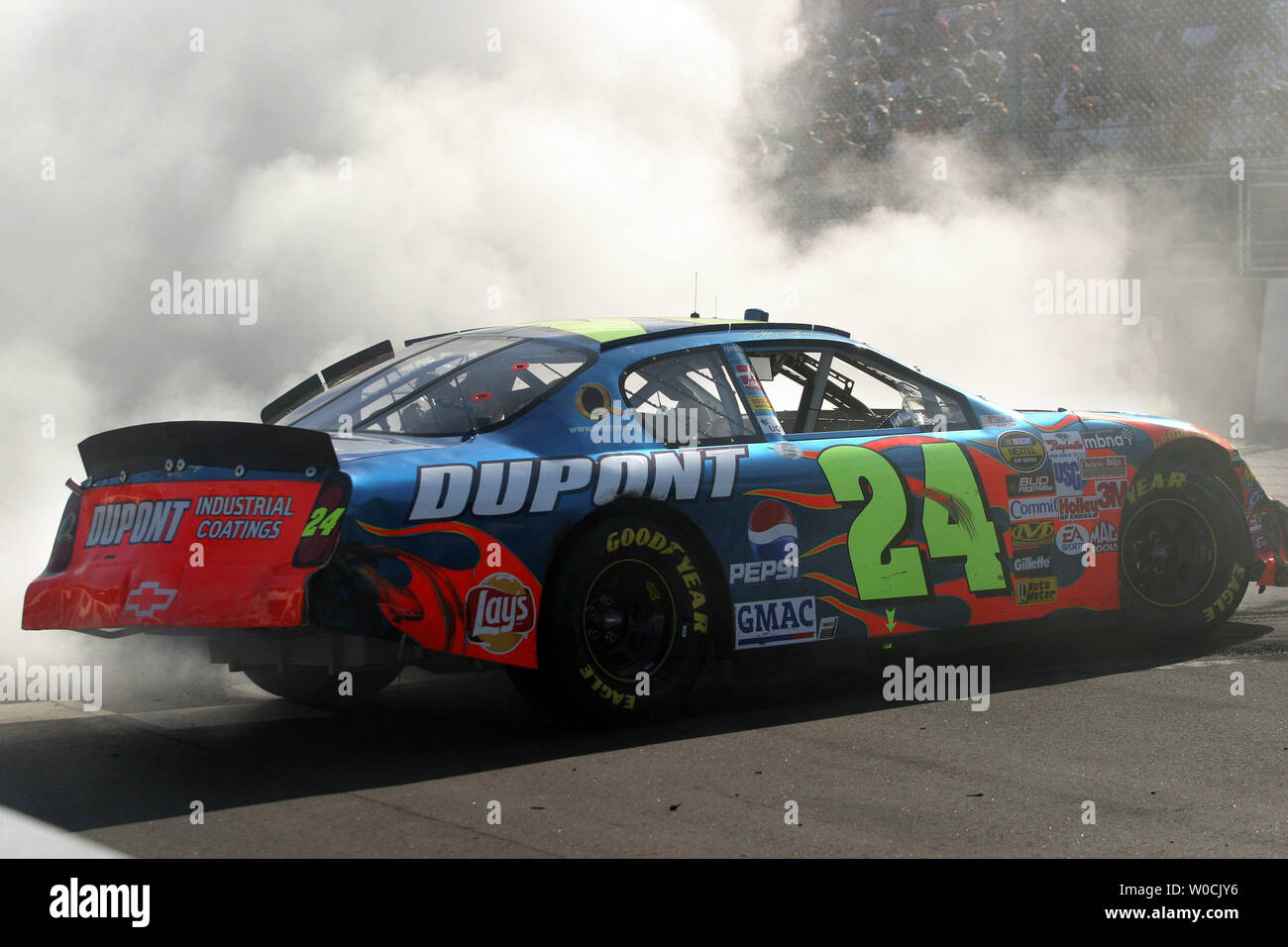 Jeff Gordon does a celebratory donuts after wining the Advance Auto