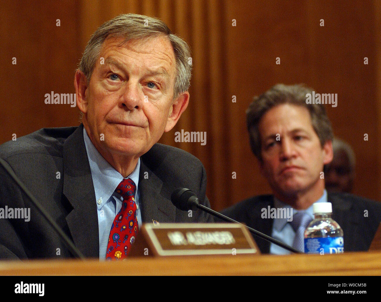 Sen. George Voinovich, R-OH, and Sen. Norm Coleman, R-MN, listen during a Senate Foreign Relations Committee meeting to vote on the nomination of John Bolton to be the U.S. ambassador to the U.N. on May 12, 2005, on Capitol Hill in Washington. Voinovich continues to oppose the nomination despite pressure from his party to support the President's choice.     (UPI Photo/Roger L. Wollenberg) Stock Photo