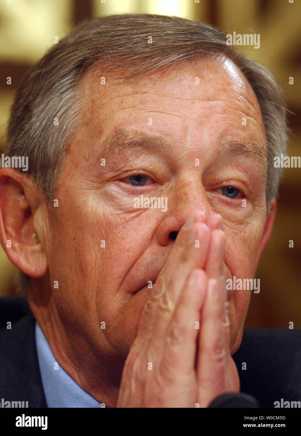 Sen. George Voinovich, R-OH, composes himself just before voting to send John Bolton to the Senate floor for a final vote on May 12, 2005, on Capitol Hill in Washington. The Senate Foreign Relations Committee held a five hour meeting to discuss and vote on Bolton, President Bush's nominee to be the U.S. ambassador to the UN.    (UPI Photo/Roger L. Wollenberg) Stock Photo