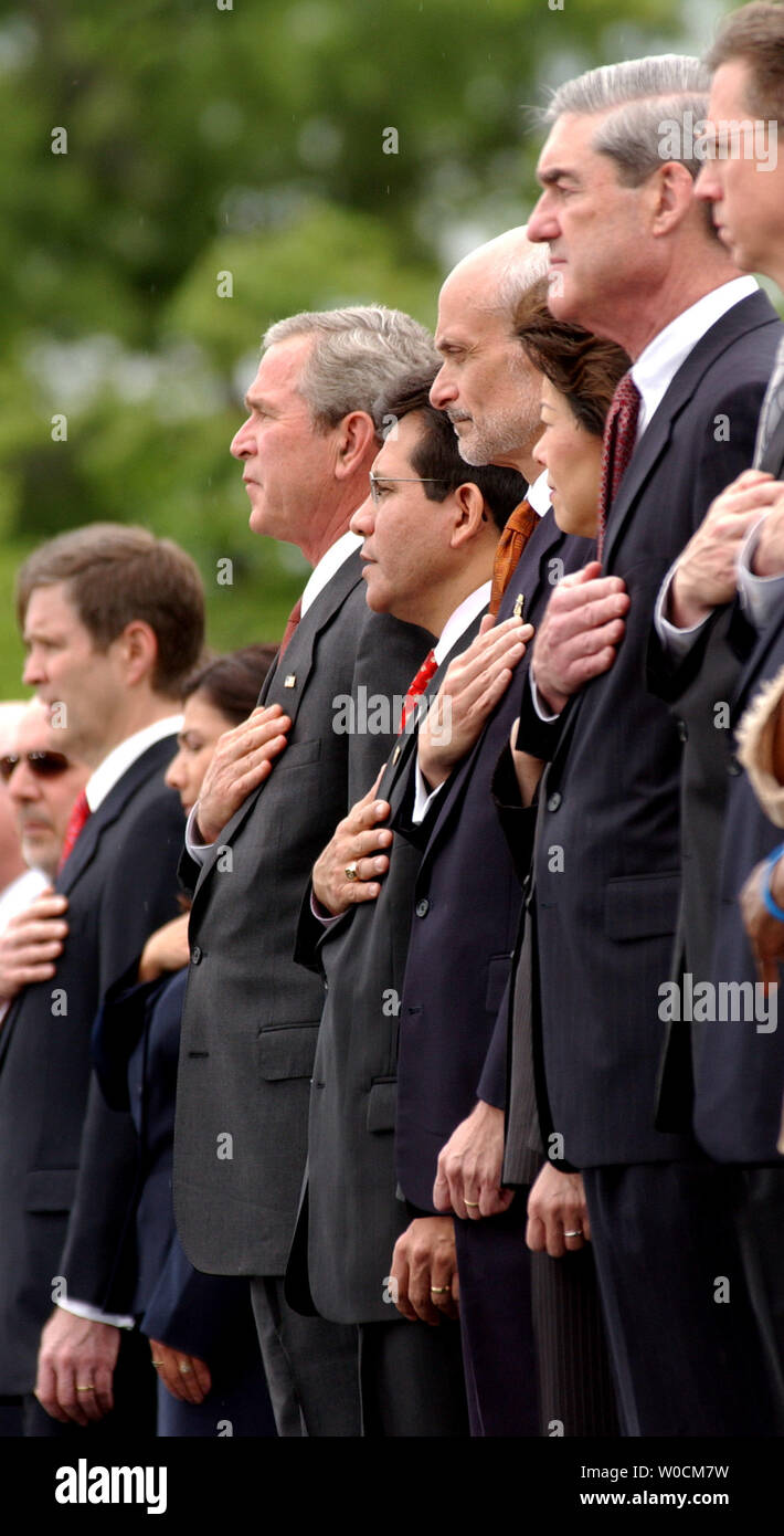 (L to R) President George W. Bush, Attorney General Alberto Gonzales, Secretary of Homeland Security Michael Chertoff and FBI Director Robert Muller place their hands over their hearts for the pledge of allegiance during the Annual Peace Officers' Memorial Service on May 15, 2005 at the Capitol building in Washington.      (UPI Photo/Michael Kleinfeld) Stock Photo
