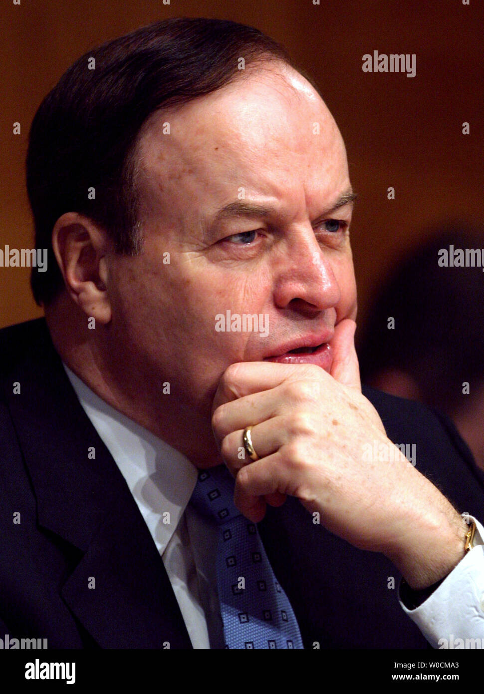 George Sauter, chief investment officer and managing director, The Vanguard Group, listens to members of the National Market Systems respond to questions on market regulations and developments at a Senate Banking, Housing and Urban Affairs Committee meeting at the Dirksen Senate Office Building in Washington, DC on May 18, 2005. (UPI Photo/Kevin Dietsch) Stock Photo