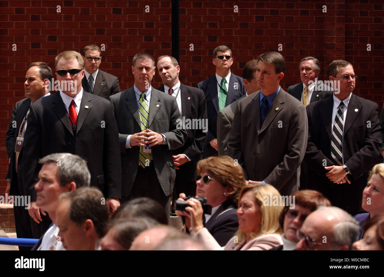 Security Service personnel stand by as  Deputy Director of National Intelligence, U.S. Air Force Lt Gen. Michael Hayden, and the first Director of National Intelligence, John Negroponte, not shown, are sworn into their new jobs on May 18, 2005 in Washington.  The new positions will coordinate national and international intelligence in a way deemed necessary after the attacks on 9/11. (UPI Photo/Michael Kleinfeld) Stock Photo