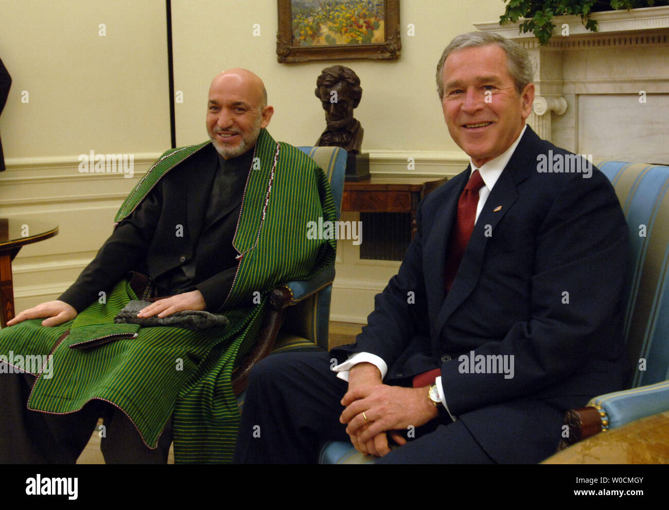 Afghan President Hamid Karzai, left, is welcomed to the oval office by President George W. Bush, on May 23, 2005 in Washington.  Bush and Karzai talked about prisoner abuse, drug production and the war in Iraq.  (UPI Photo/Michael Kleinfeld) Stock Photo