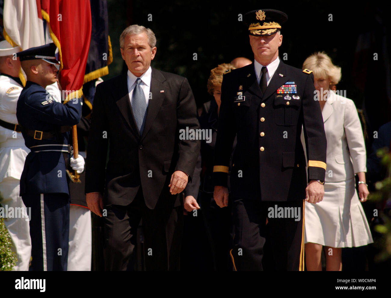 President George W. Bush arrives to participate in a Memorial Day ceremony at the Tomb of the Unknowns, on May 30, 2005 in Arlington National Cemetery. Maj. Gen. Galen B. Jackman stands on the President's right.  This year, members of the armed services paid special tribute to those who have died in Iraq and Afghanistan. (UPI Photo/Michael Kleinfeld) Stock Photo