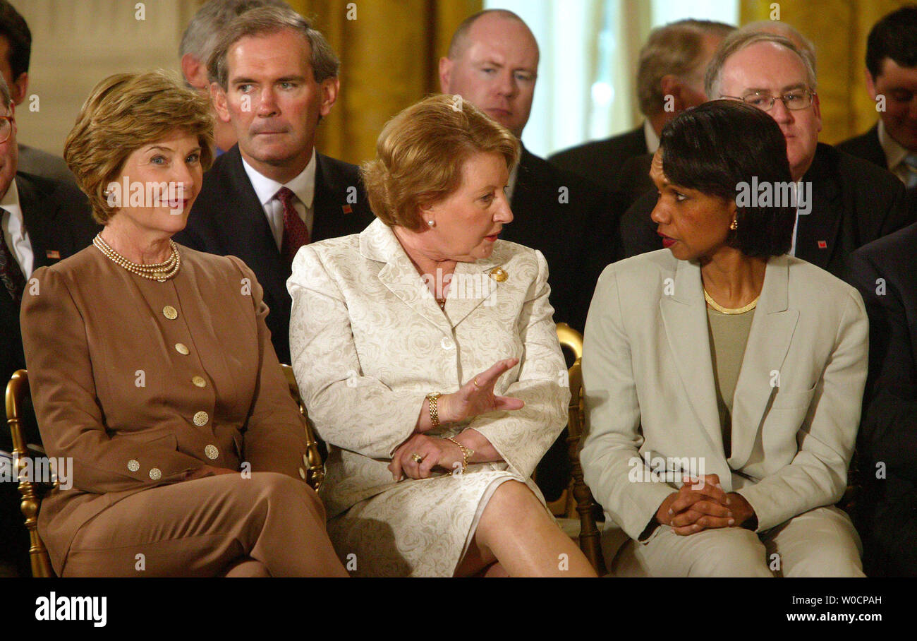 First Lady Laura Bush, Janette Howard, wife of Australian Prime Minister John Howard, and U.S. Secretary of State Condoleezza Rice (l to r) chat before a news conference with US President Bush and Howard in the East Room of the White House on July 19, 2005.    (UPI Photo/Terry Schmitt) Stock Photo