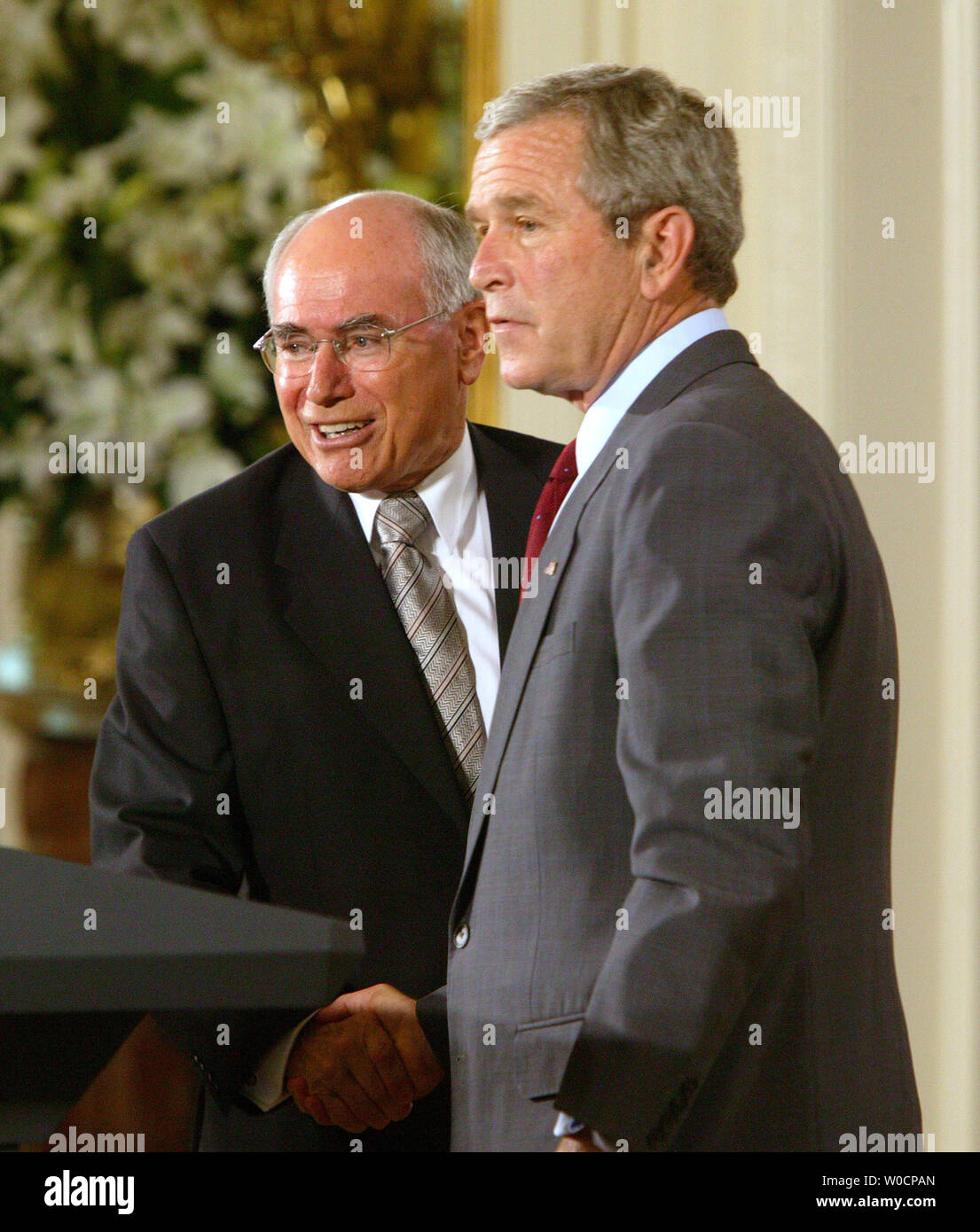U.S. President George W. Bush and Australian Prime Minister John Howard shake hands after speaking to the media in the East Room of the White House after their meeting on July 19, 2005.   (UPI Photo/Terry Schmitt) Stock Photo