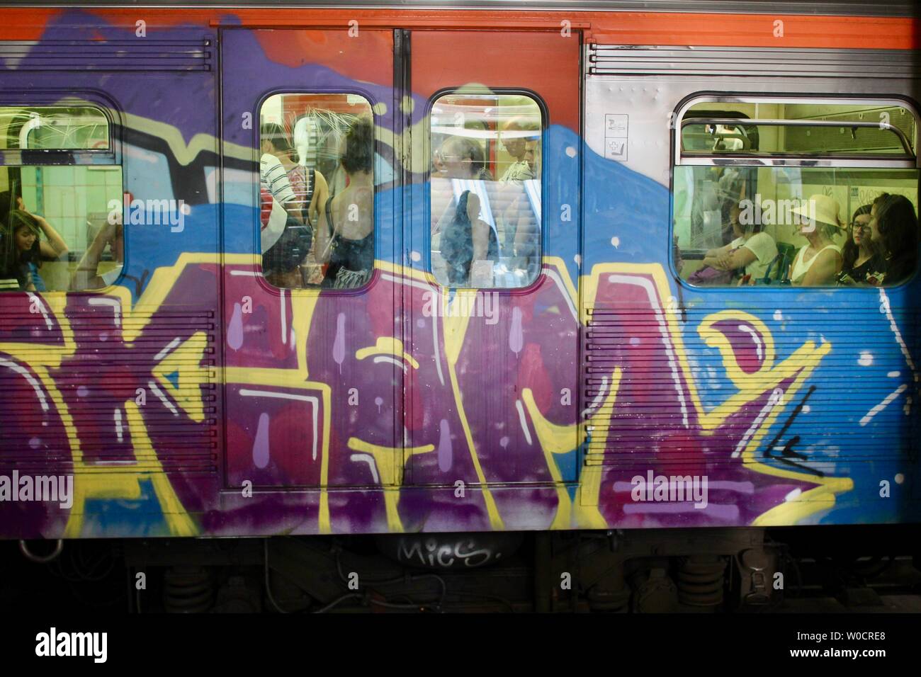 heavily graffitied passenger train in athens greece Stock Photo