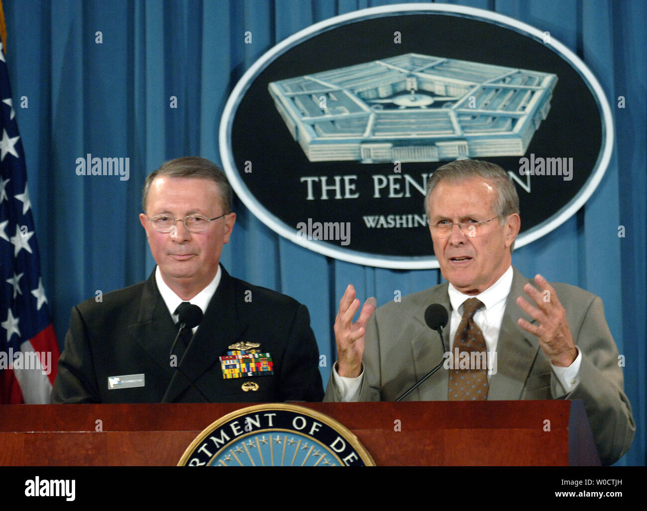 Vice Chairman, Joint Chiefs of Staff, Adm. Edmund Giambastiani (L) and Secretary of Defense Donald Rumsfeld speak at a press conference on the Iraq war during a joint press conference in the Pentagon on November, 15 2005. Rumsfield defended America’s reason for going to war restating that Saddam Hussein was a security threat to the United States and its allies. (UPI Photo/Kevin Dietsch) Stock Photo