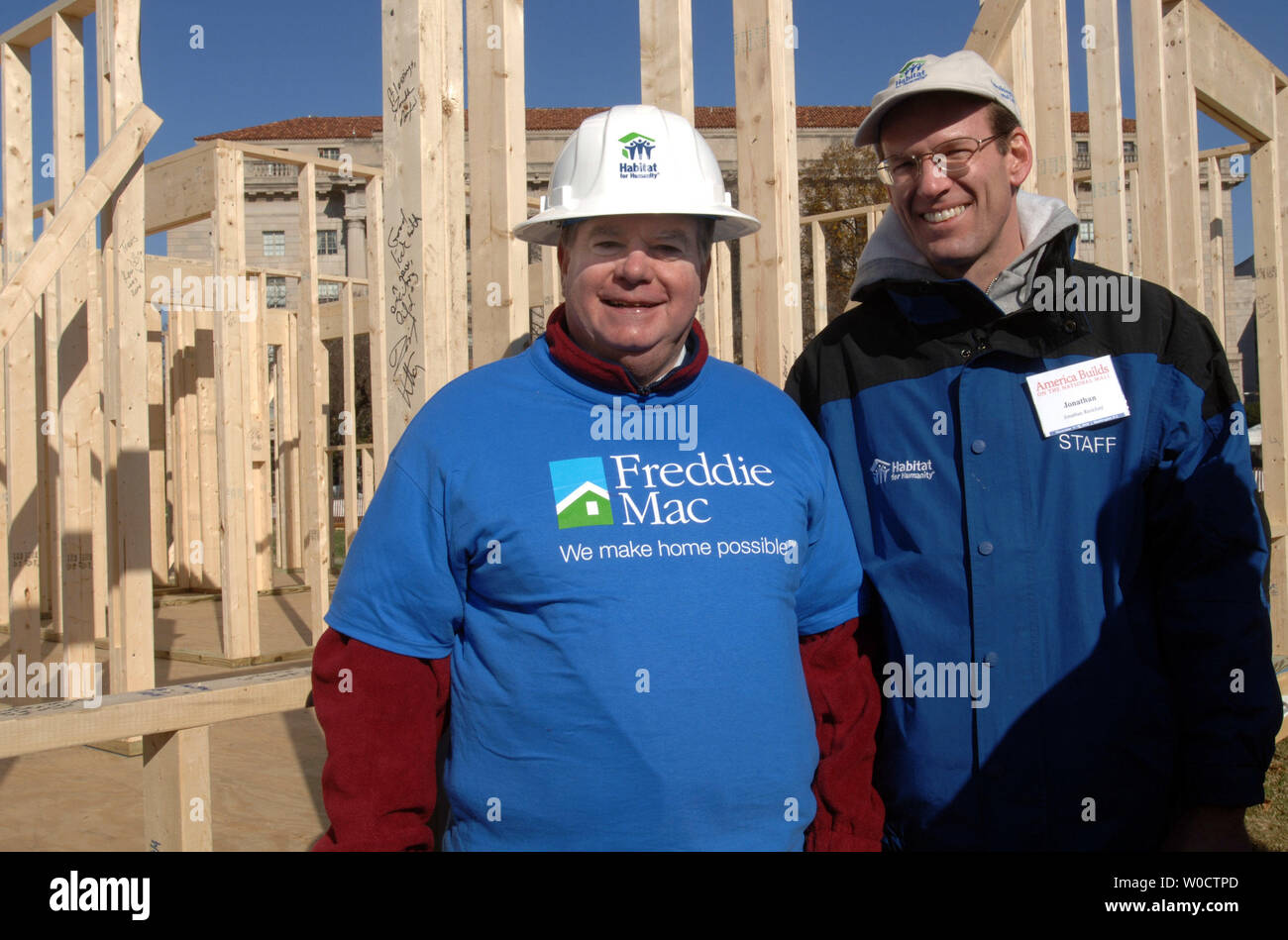 President of Freddie Mac Gene McQuade (L) and CEO of Habitat for Humanity international Jonathan Reckford pose for a photo in front of a Habitat for Humanity house during the Habitat for Humanity America Builds Project, in Washington on November 18, 2005. The America Builds project is a week long 51 house build off for the the hurricane Katrina affected families of the Gulf Coast region. (UPI Photo/Kevin Dietsch) Stock Photo