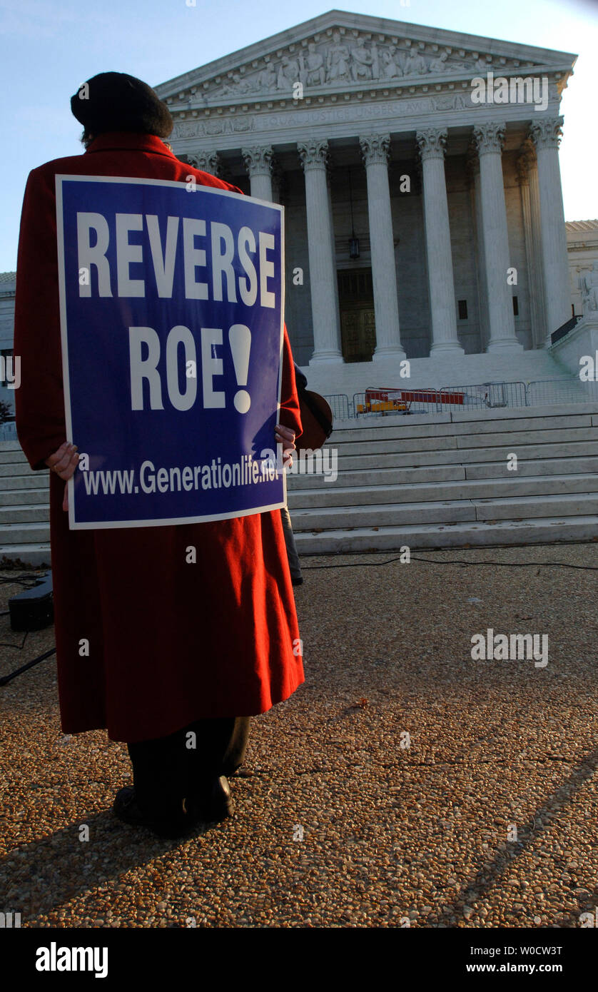 A Pro-Life demonstrator stands in front of the Supreme Court while the court hears arguments on the Scheidler and Ayotte abortion case, in Washington on November 30, 2005. This is the third time abortion has come into debate in the Supreme Court. (UPI Photo/Kevin Dietsch) Stock Photo