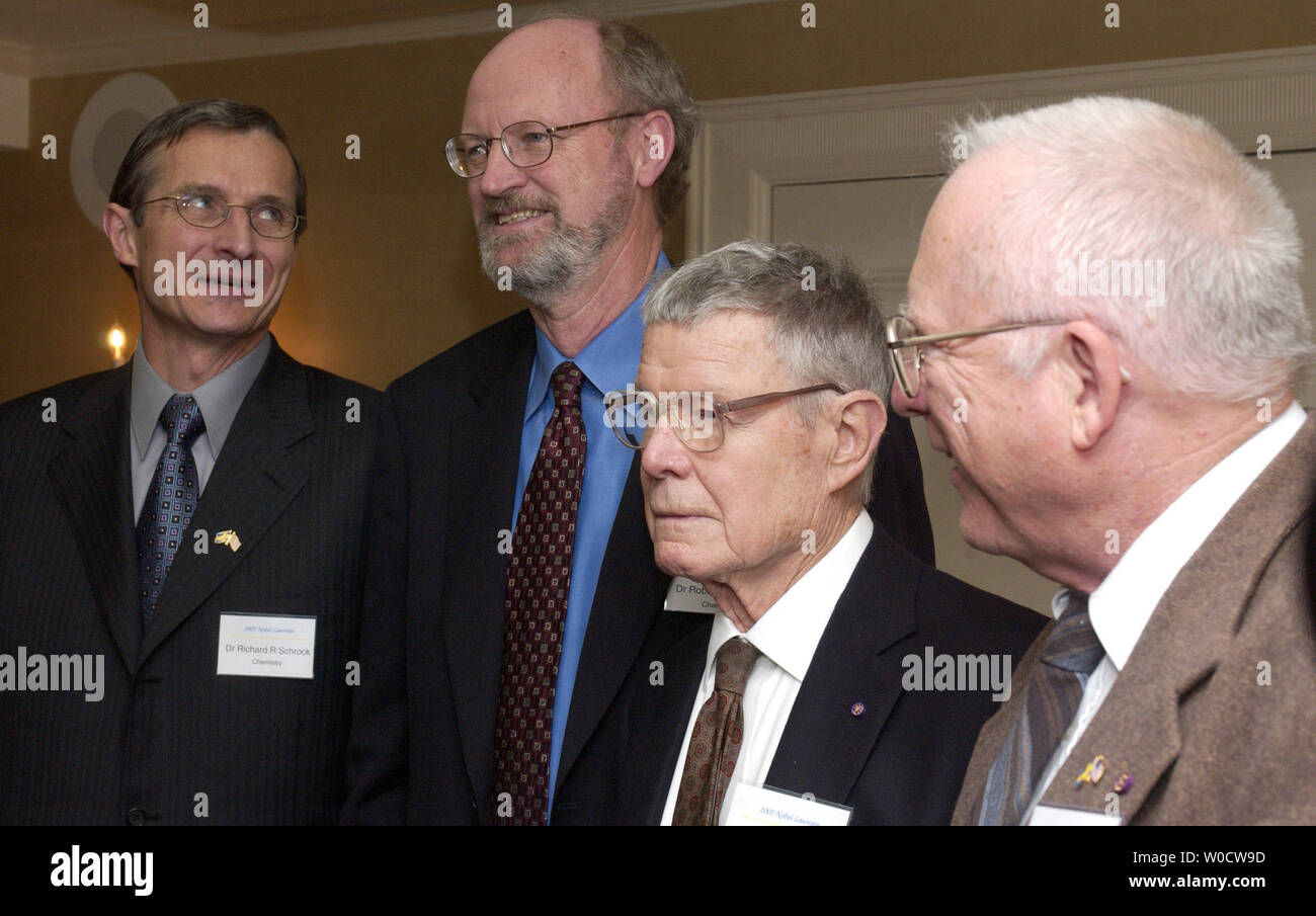 U.S. Nobel Prize Laureates, from the left, Richard Schrock, Robert Grubbs, Thomas Schelling and John Hall talk during a press conference honoring their work in Washington on November 7, 2005. (UPI Photo/Kevin Dietsch) Stock Photo