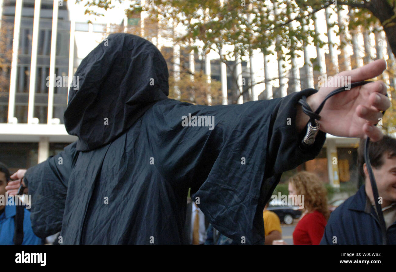 A man dressed as a torture victim rallies against the Iraqi Deputy Prime Minister Ahmed Chalabi outside of the American Enterprise Institute where he was giving a speech on the rebuilding of Iraq in Washington on November, 9 2005. (UPI Photo/Kevin Dietsch) Stock Photo