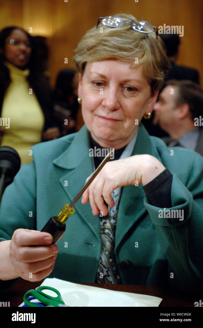 International President of the Association of Flight Attendants Pat Friend shows off a screw driver at a Senate Commerce, Science and Transportation Committee hearing on the Transportation Security Administration's (TSA) possible changing of the prohibited carry-on items list for air travel, in Washington on December 12, 2005. Under the TSA's proposed polity screw drivers and smaller sets of scissors will be allowed. Friend does not support the new proposed policy. (UPI Photo/Kevin Dietsch) Stock Photo