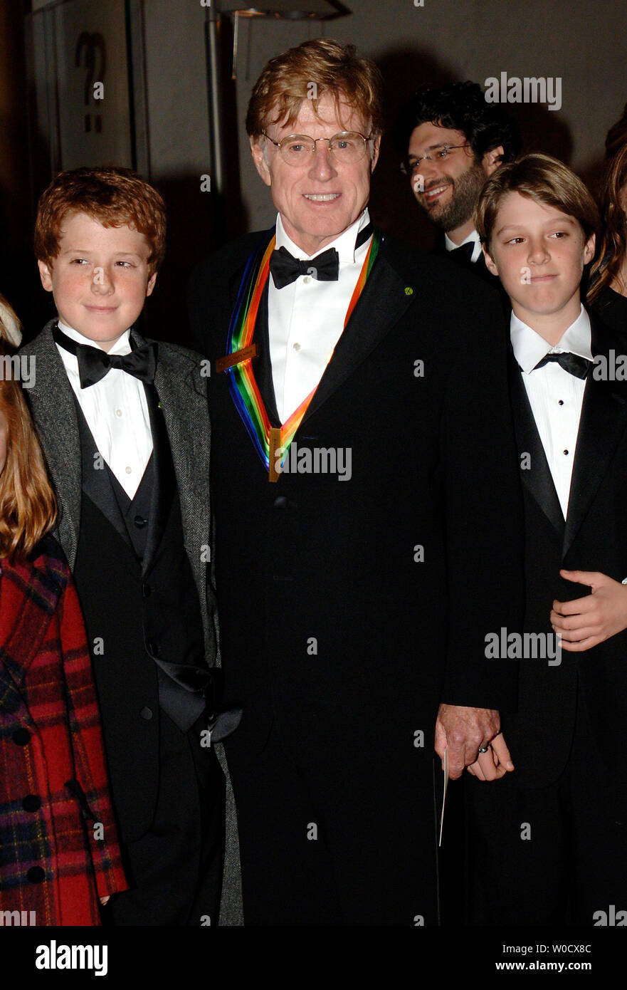 Actor Robert Redford and his family walk the red carpet before the