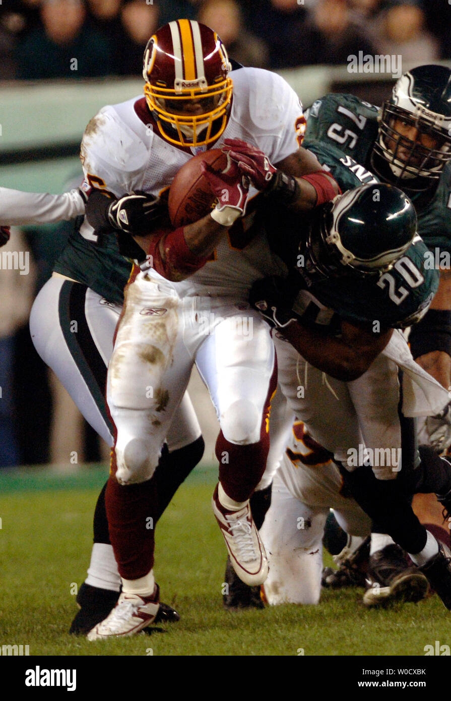 Washington Redskins running back Clinton Portis runs for a first down against Philadelphia Eagles' Brian Dawkins, during the second quarter at Lincoln Financial Field in Philadelphia, PA on January 1, 2006. (UPI Photo/Kevin Dietsch) Stock Photo