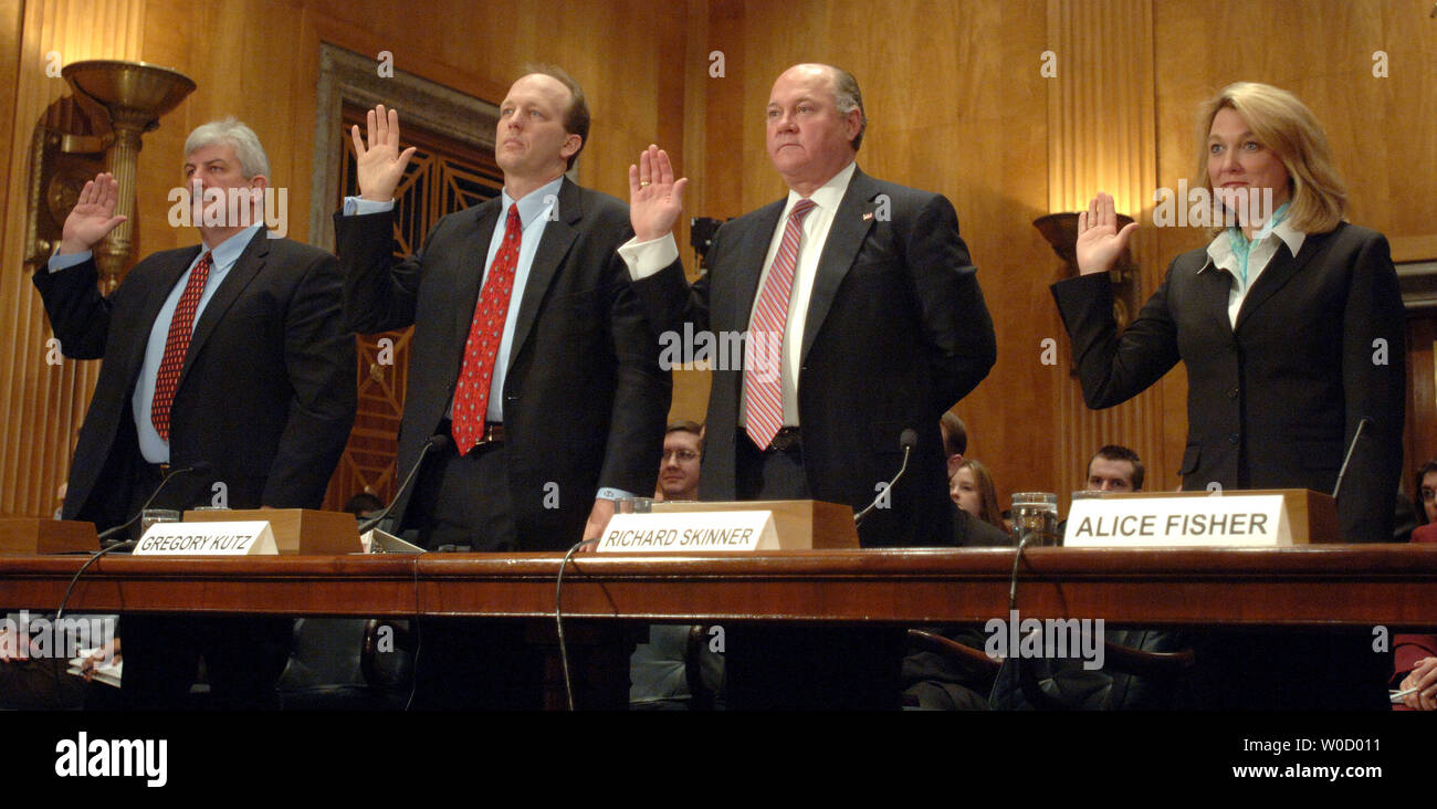 Fraud and waste investigators John Ryan, Gregory Kutz, Richard Skinner and Alice Fisher (L to R) are sworn in prior to testifying before the Senate Homeland Security and Governmental Affairs Committee about the waste and fraud generated in the aftermath of Hurricane Katrinta during a hearing on Capitol Hill in Washington on February 13, 2006. Witnesses described millions of dollars in fraudulent emergency payments and waste generated by poor oversight and planning by FEMA.   (UPI Photo/Roger L. Wollenberg) Stock Photo
