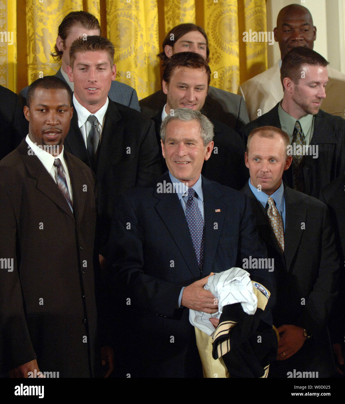 U.S. President George W. Bush poses for a picture during a ceremony in ...