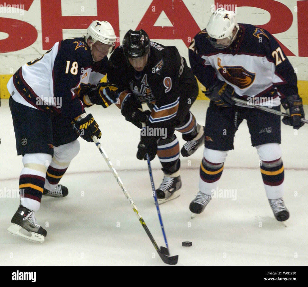 Washington Capitals Daninius Zubrus (9)  carries the puck against Atlanta Thrashers Marian Hossa (18) and Patrik Stefan (27), during the second period at the Verizon Center in Washington on April 17, 2006. The Capitals defeated the Thrashers 6-4. (UPI Photo/Kevin Dietsch) Stock Photo