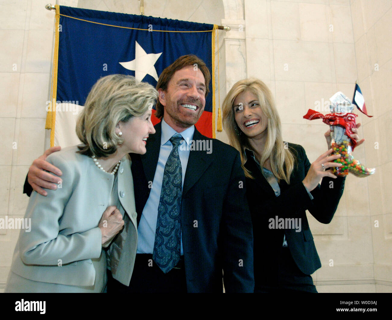 Sen. Kay Baily Hutchison R TX jokes with actor Chuck Norris C