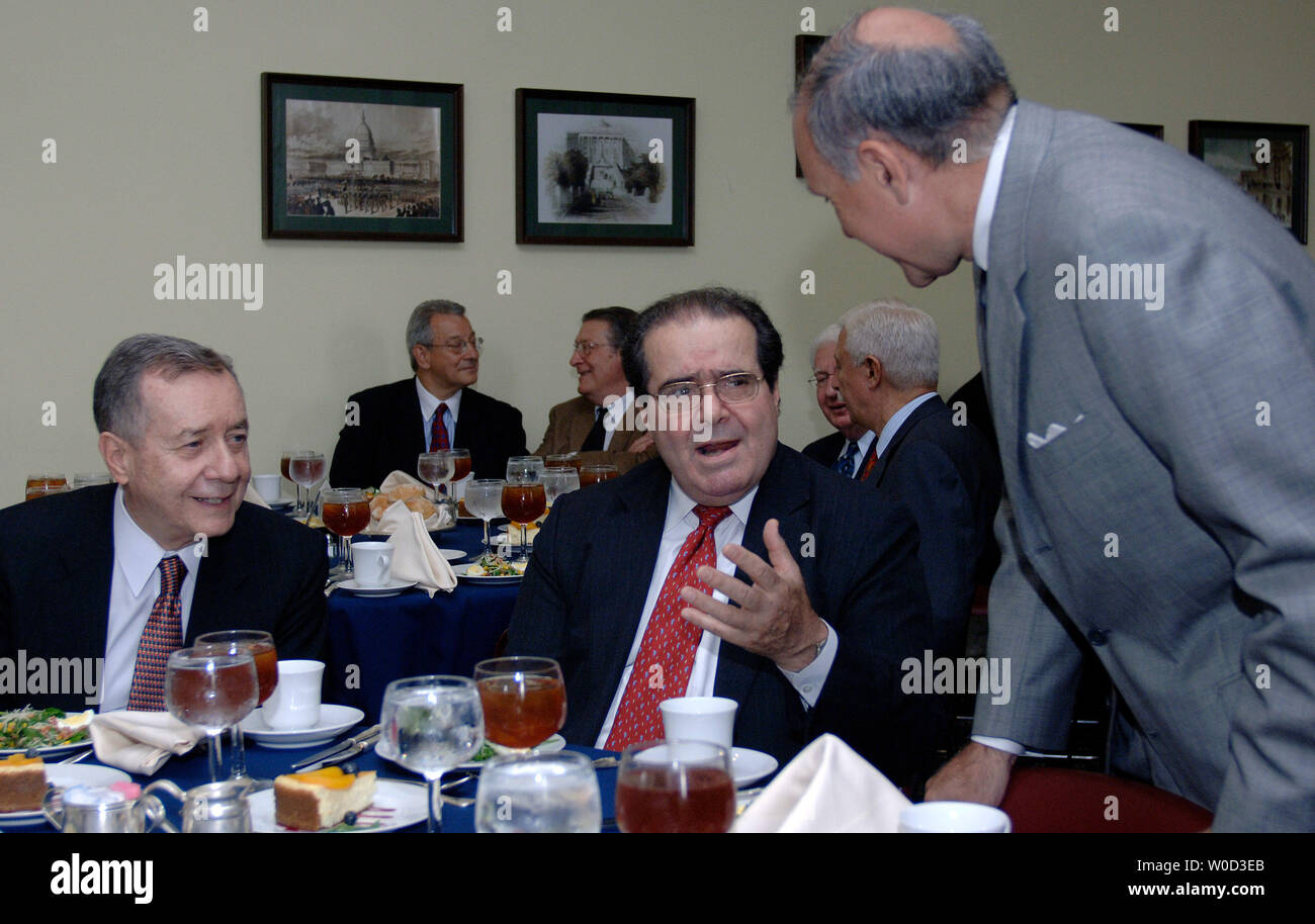 Supreme Court Justice Antonin Scalia (C) talks to The National Italian American Foundation (NIAF) board of directors member Joseph V. DelRaso, while NIAF Chairman Frank Guarini watches on, at a NIAF luncheon in Washington on May 18, 2006. (UPI Photo/Kevin Dietsch) Stock Photo