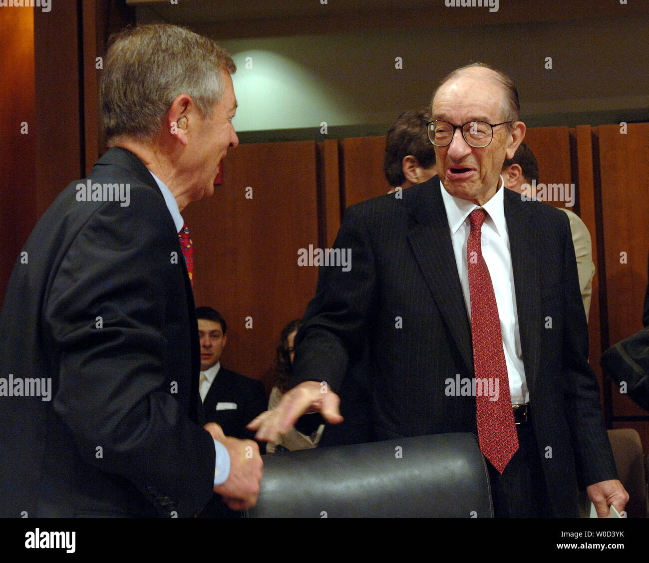 Former Federal Reserve Board Chairman Alan Greenspan greets Sen. George Voinovich, R-OH, prior to testifying before the Senate Foreign Relations Committee about the economic risks of oil dependence during a hearing on Capitol Hill in Washington on June 7, 2006.   (UPI Photo/Roger L. Wollenberg) Stock Photo