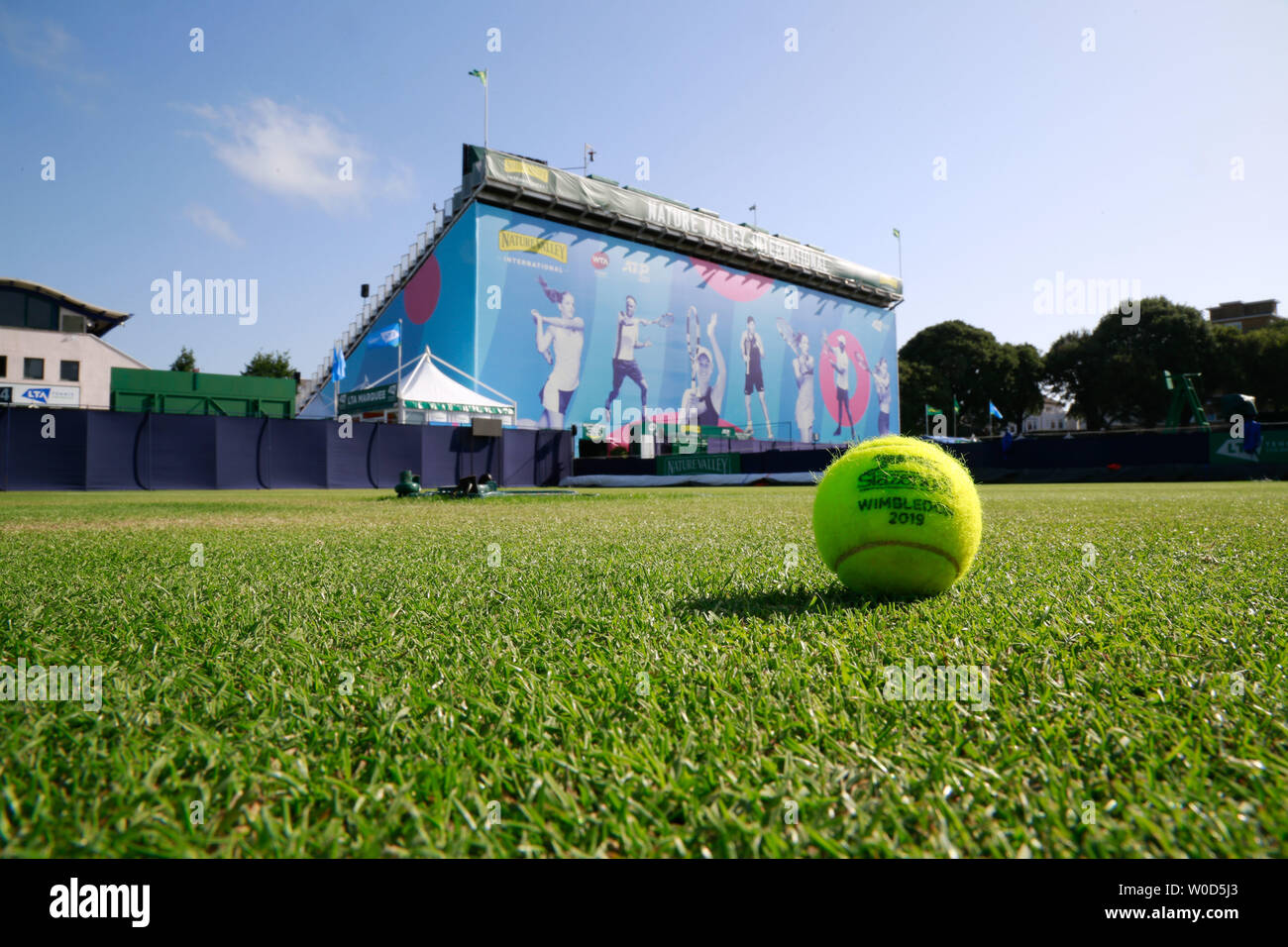 Devonshire Park, Eastbourne, UK. 27th June, 2019. Nature Valley International Tennis Tournament; A tournement ball with Wimbledon logo on the grass outside centre court Credit: Action Plus Sports/Alamy Live News Stock Photo