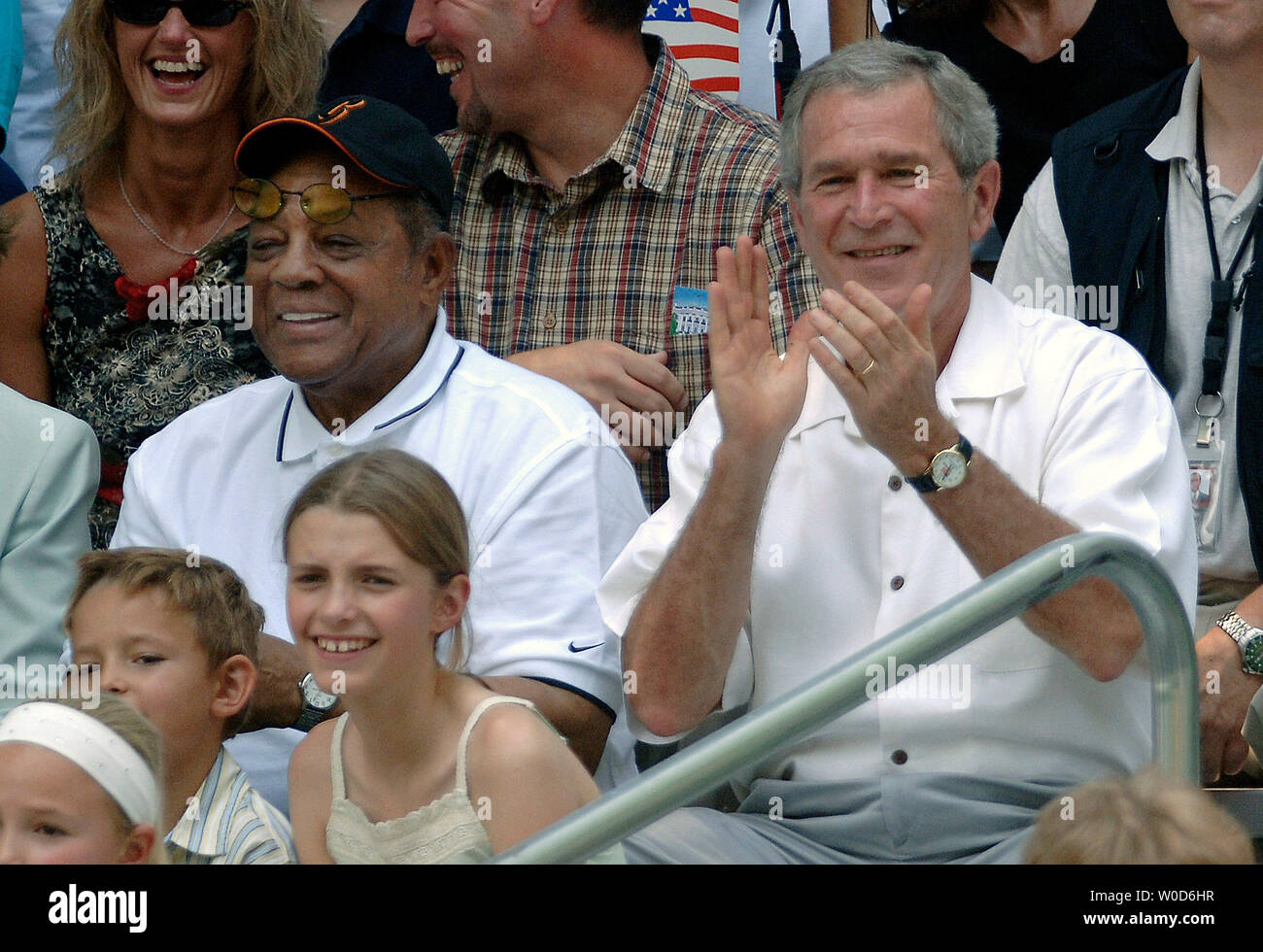 President George W. Bush (R) and National Baseball Hall of Fame member Willie Mays watch the White House Tee Ball Game on the South Lawn at the White House on July 30, 2006. (UPI Photo/Kevin Dietsch) Stock Photo