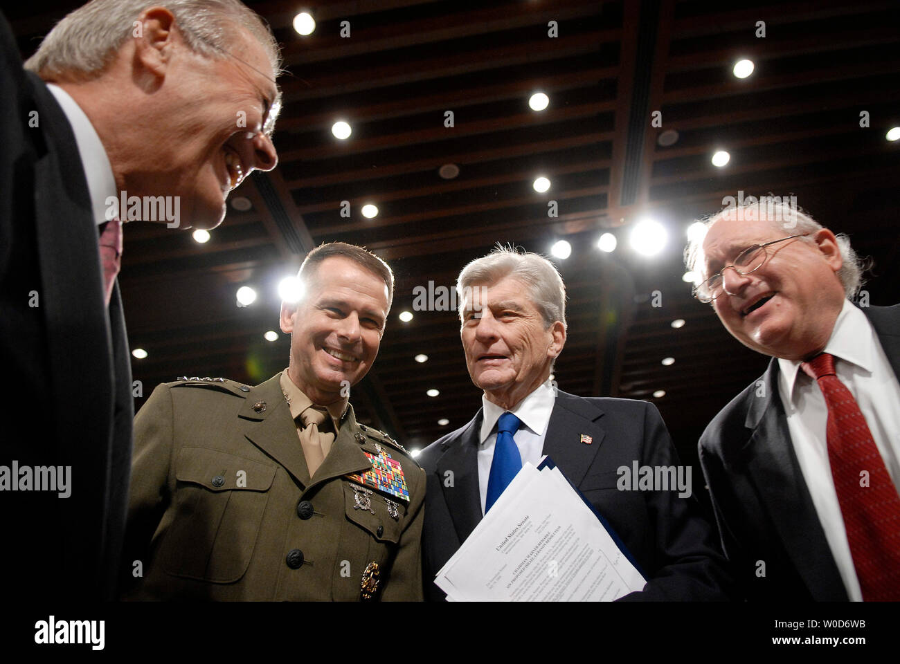 From left to right, Secretary of Defense Donald Rumsfeld, Chairman of the Joint Chiefs of Staff Gen. Peter Pace, Sen John Warner (R-VA) and Sen. Carl Levin (D - MI) talk prior to a Senate Armed Services Committee hearing on Iraq, Afganistran and the global war on terror, in Washington on August 3, 2006. (UPI Photo/Kevin Dietsch) Stock Photo