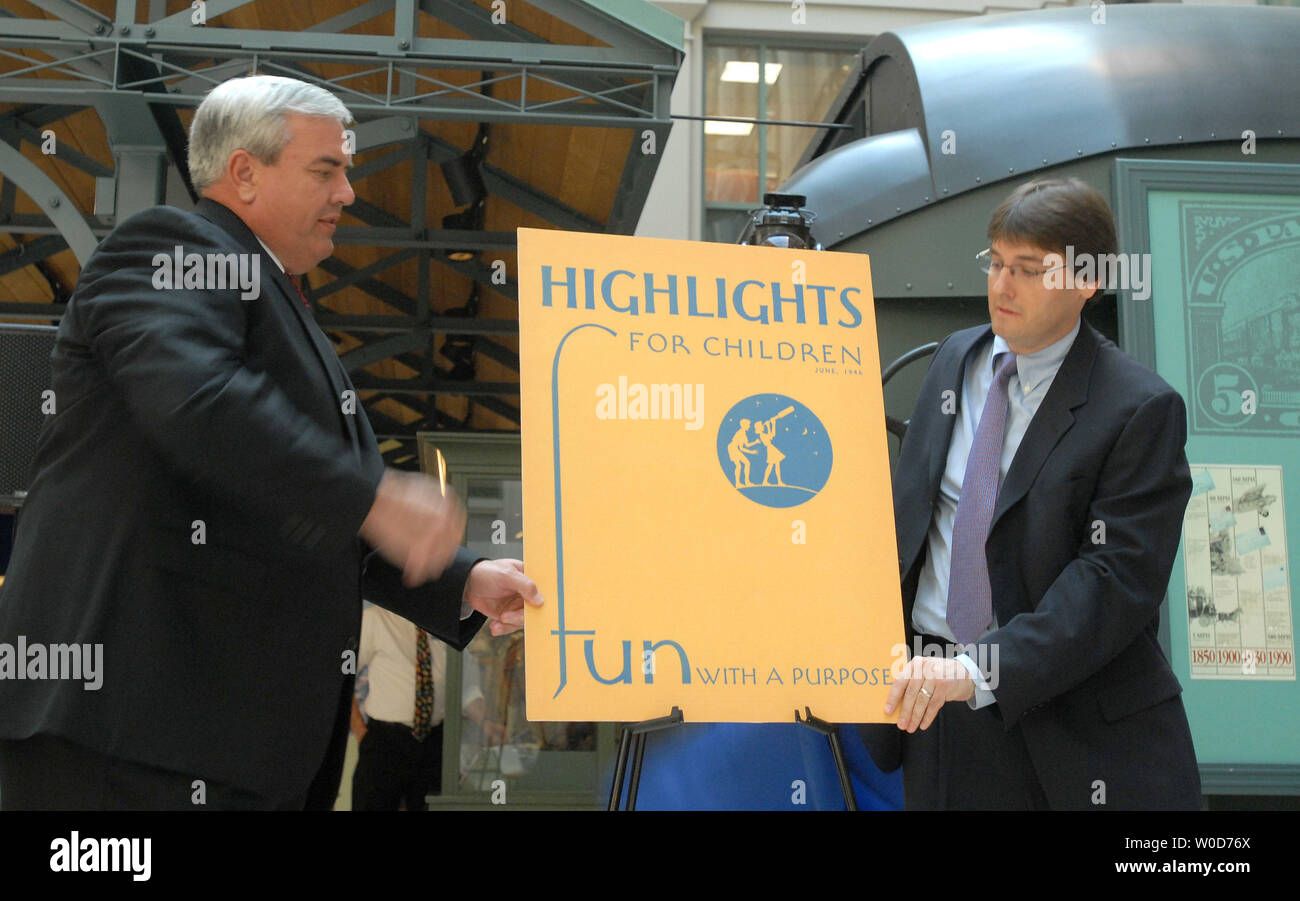 Kent Johnson, CEO of the magazine, (R) and Postmaster General John Potter view a copy of the magainze's first issue as the U.S. Postal Service and Highlights for Children, Inc. hold an event to celebrate the printing of 1 billion copies of Highlights for Children magazine at the National Postal Museum in Washington on August 23, 2006.    (UPI Photo/Roger L. Wollenberg) Stock Photo