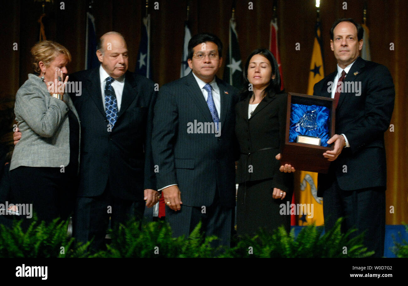 Henry Sentner Attorney General Alberto Gonzales (C) stands with members of the ...