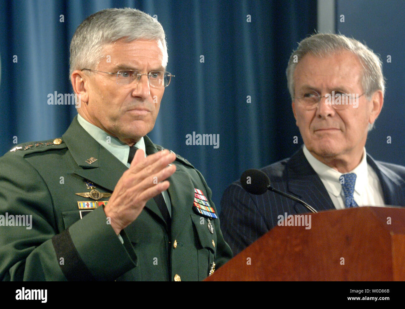 Secretary of Defense Donald Rumsfeld (R) and army Gen. George W. Casey hold a press conference at the Pentagon, in Arlington, Virginia on October 11, 2006. (UPI Photo/Kevin Dietsch) Stock Photo