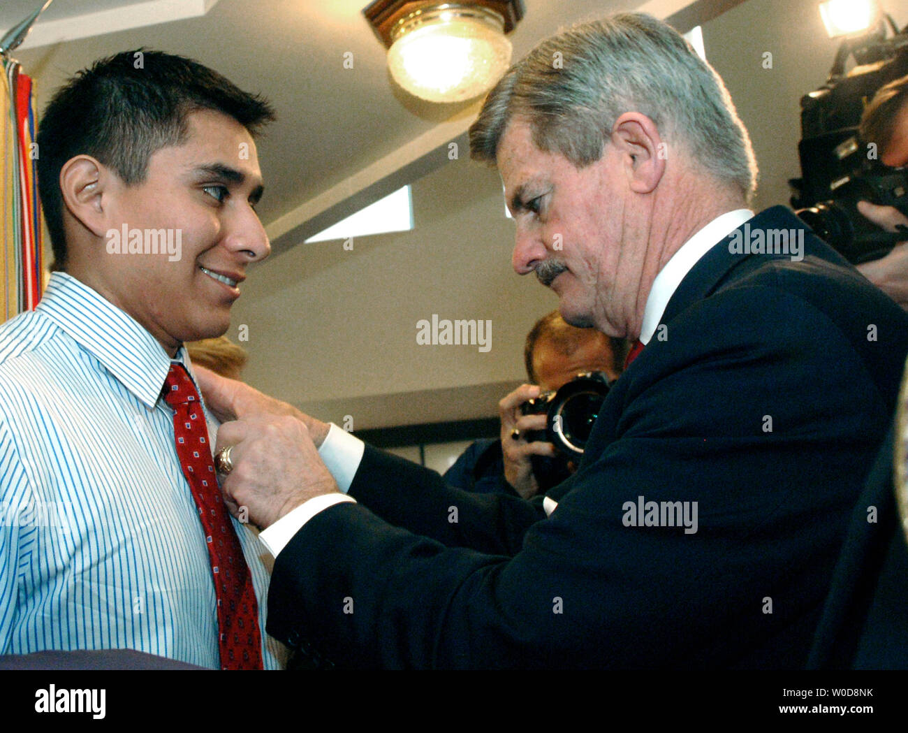 Secretary of Veterans Affairs James Nicholson (R) awards the Military Order of the Purple Heart to Pvt. Kevin Araujo, from Houston, TX for wounds suffered while serving in Iraq, during a ceremony in Washington on November 1, 2006. Three other Iraqi Veterans received the Purple Heart including Sgt. Jeffrey Combs, USMC 2nd Tank Battalion, 2nd Marine Division, from White Plains, N.Y.;Sgt. Tyrone Carelock, 74th Troop Command, District of Columbia Army National Guard from Washington, D.C. ; and Spc. Nicholas Helfferich, 2nd Battalion, 37th Armor, 1st Armored Division, from Latrobe, PA. (UPI Photo/K Stock Photo