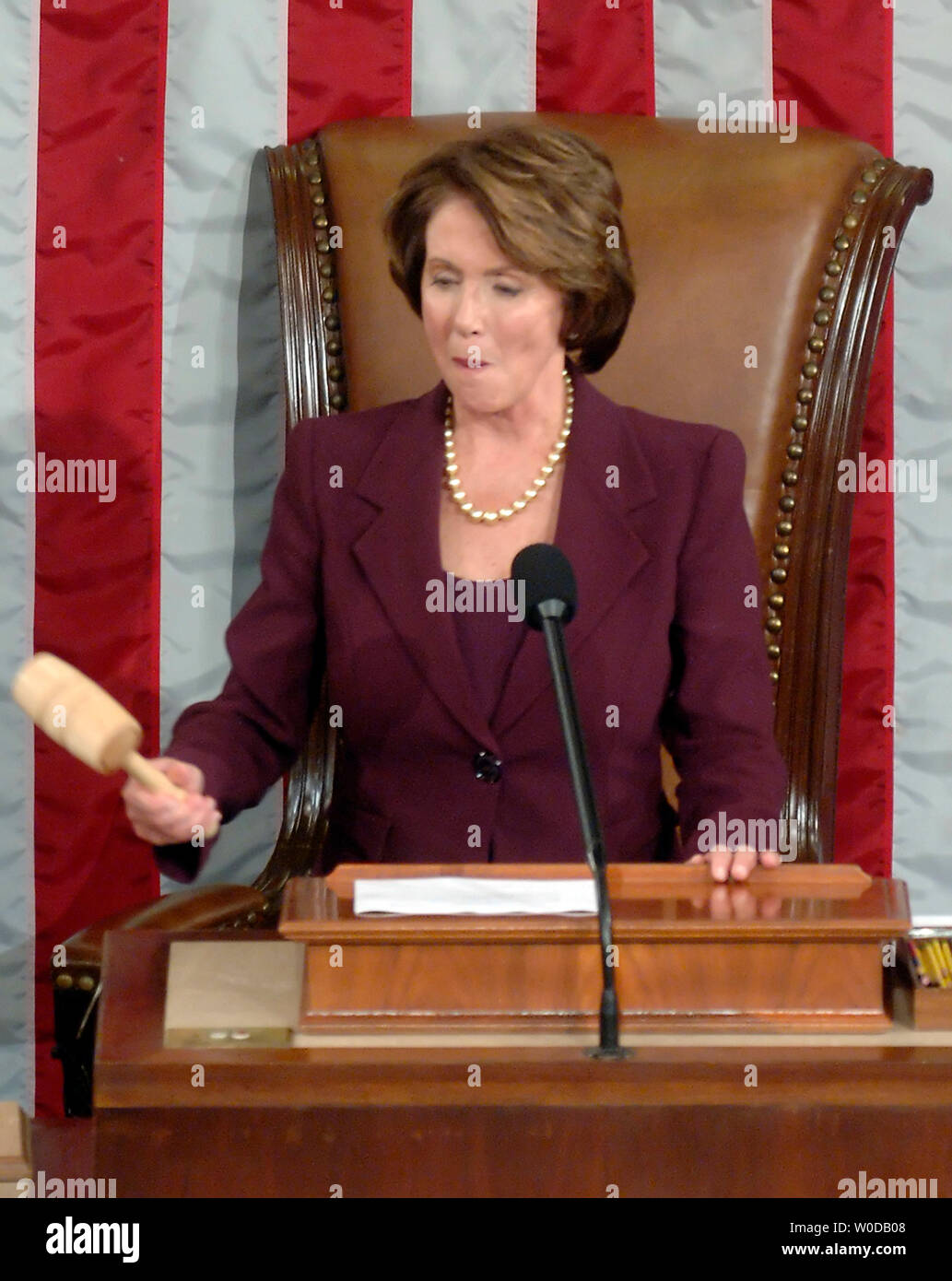 Speaking of the House Nancy Pelosi (DCA) bangs the Speaker's