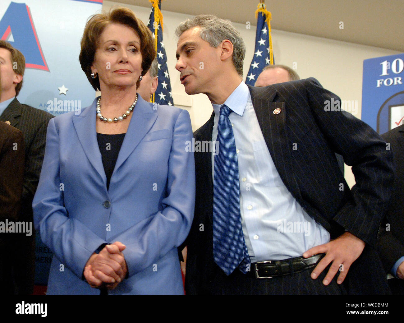 Rep. Rahm Emanuel (D-IL) speaks to Speaker of the House Nancy Pelosi (D-CA) at a press conference marking the first 100 legislative hours of the new Congress, in Washington on January 18, 2007. (UPI Photo/Kevin Dietsch) Stock Photo
