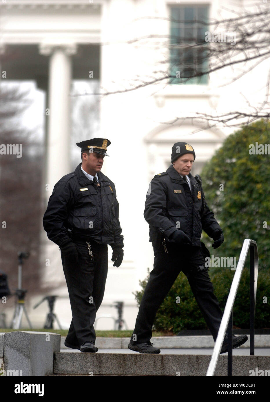 Uniformed Secret Service police officers stands guard after The White House briefing room was shut down due to a suspicious vehicle, in Washington on February 2, 2007. (UPI Photo/Kevin Dietsch) Stock Photo