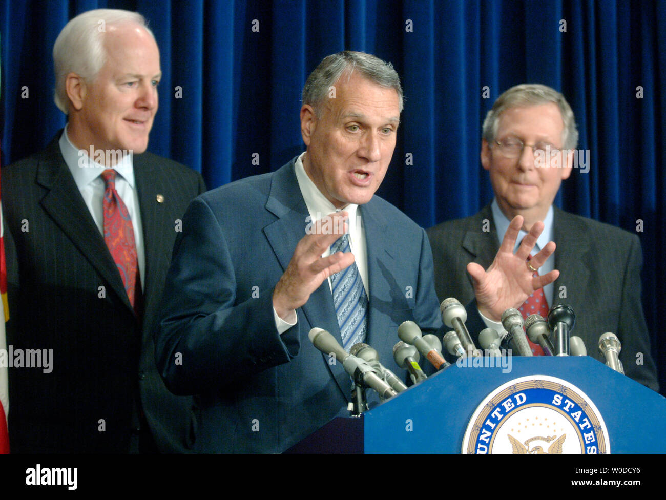 Sen. John Kyl (R-AZ) (C) speaks about the Senate GOP Agenda for the 110th Congress, in Washington on February 15, 2007. Kyl was joined by Sen. John Cornyn (R-TX) (L) and Senate Minority Leader Mitch McConnell (R-KY). (UPI Photo/Kevin Dietsch) Stock Photo