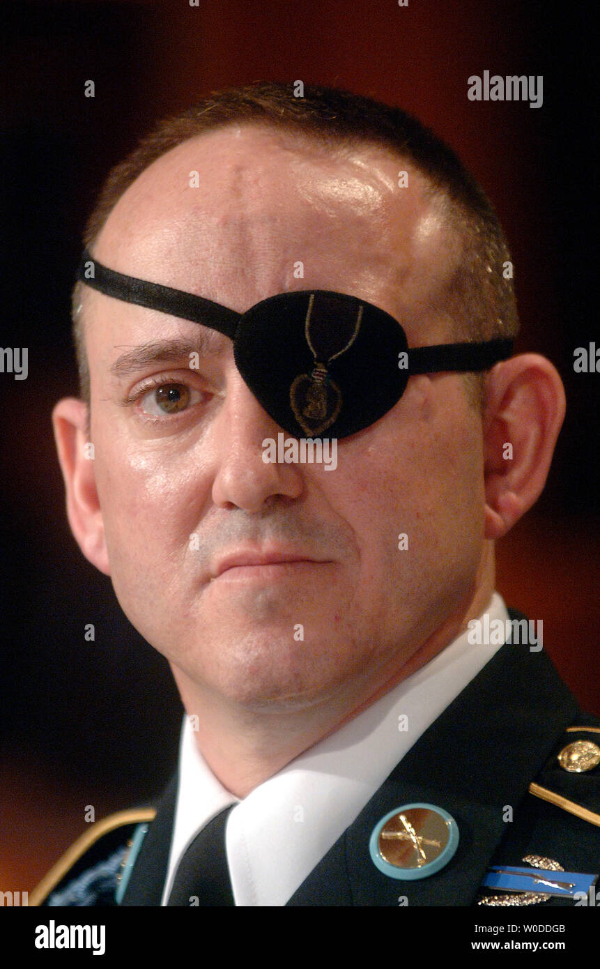 Army Staff Sgt. John Daniel Shannon, who lost his eye in combat operations in Iraq and received treatment at the Walter Reed Army Medical Center, testifies to a House Oversight and Government Reform Committee Hearing on the care and conditions of wounded soldiers at Walter Reed, in Washington at the Walter Reed Army Medical Center on March 5, 2007. (UPI Photo/Kevin Dietsch) Stock Photo