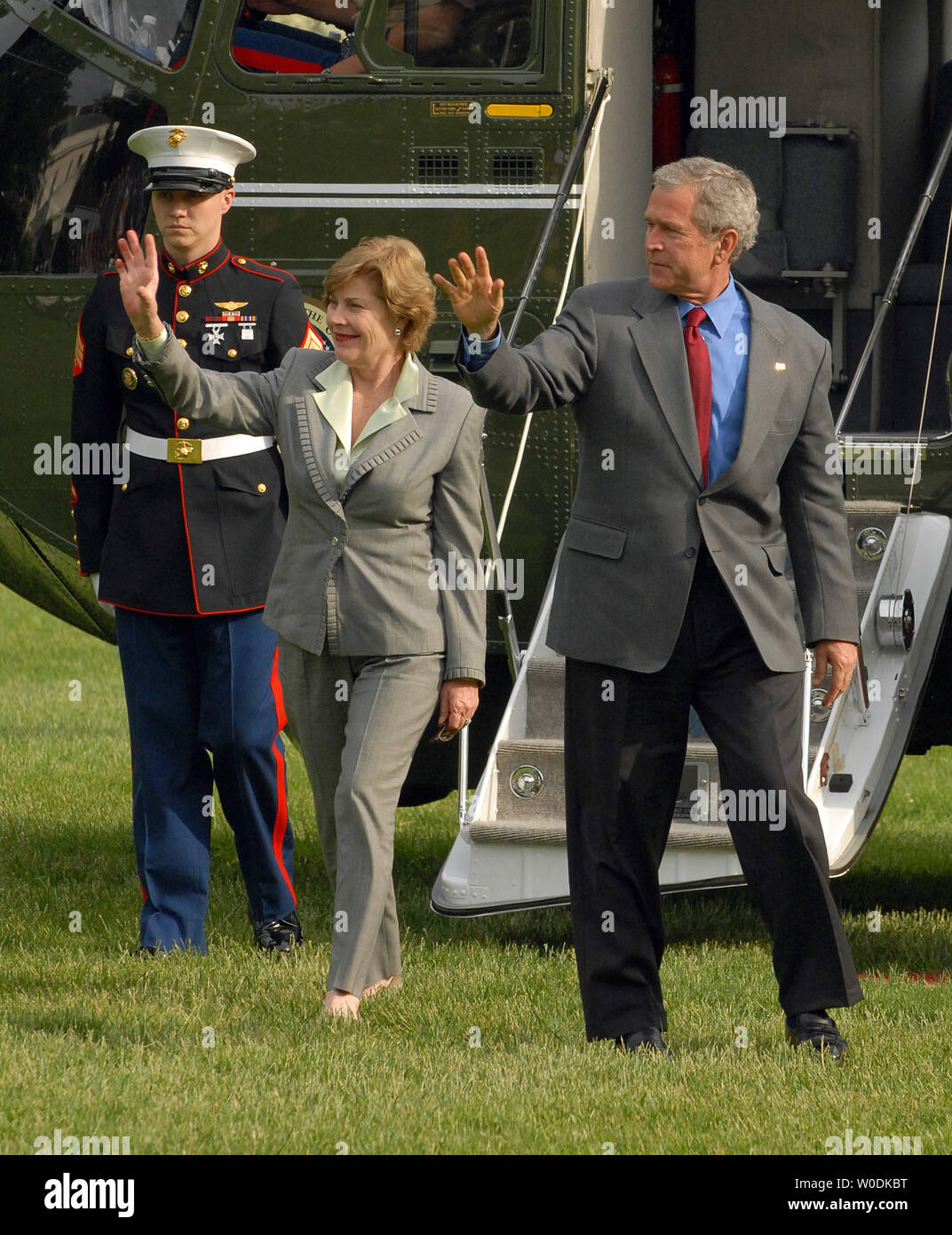 U.S. President George W. Bush and First Lady Laura Bush arrive on the South Lawn of the White House in Washington on May 21, 2007. Bush spent the meeting at his ranch in Crawford, Texas.   (UPI Photo/Roger L. Wollenberg) Stock Photo