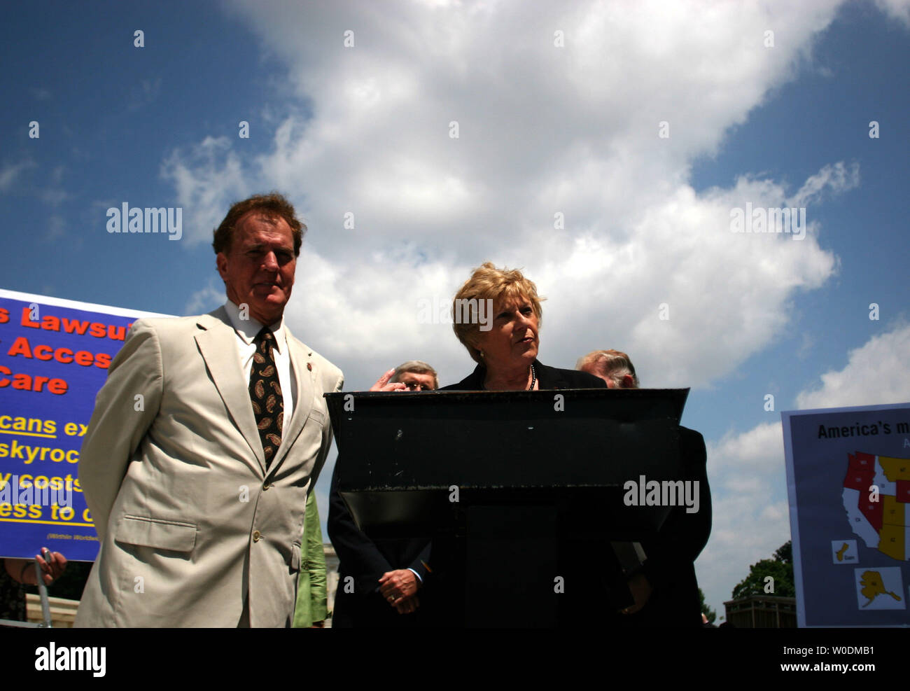 Rep. Phil Gingrey (R-GA) (L) listens as Rep. Ginny Brown-Waite (R-FL) (R) discusses her support for the Medical Liability Reform Bill at a press conference on Capitol Hill on June 6, 2007.  (UPI Photo/Dominic Bracco II) Stock Photo