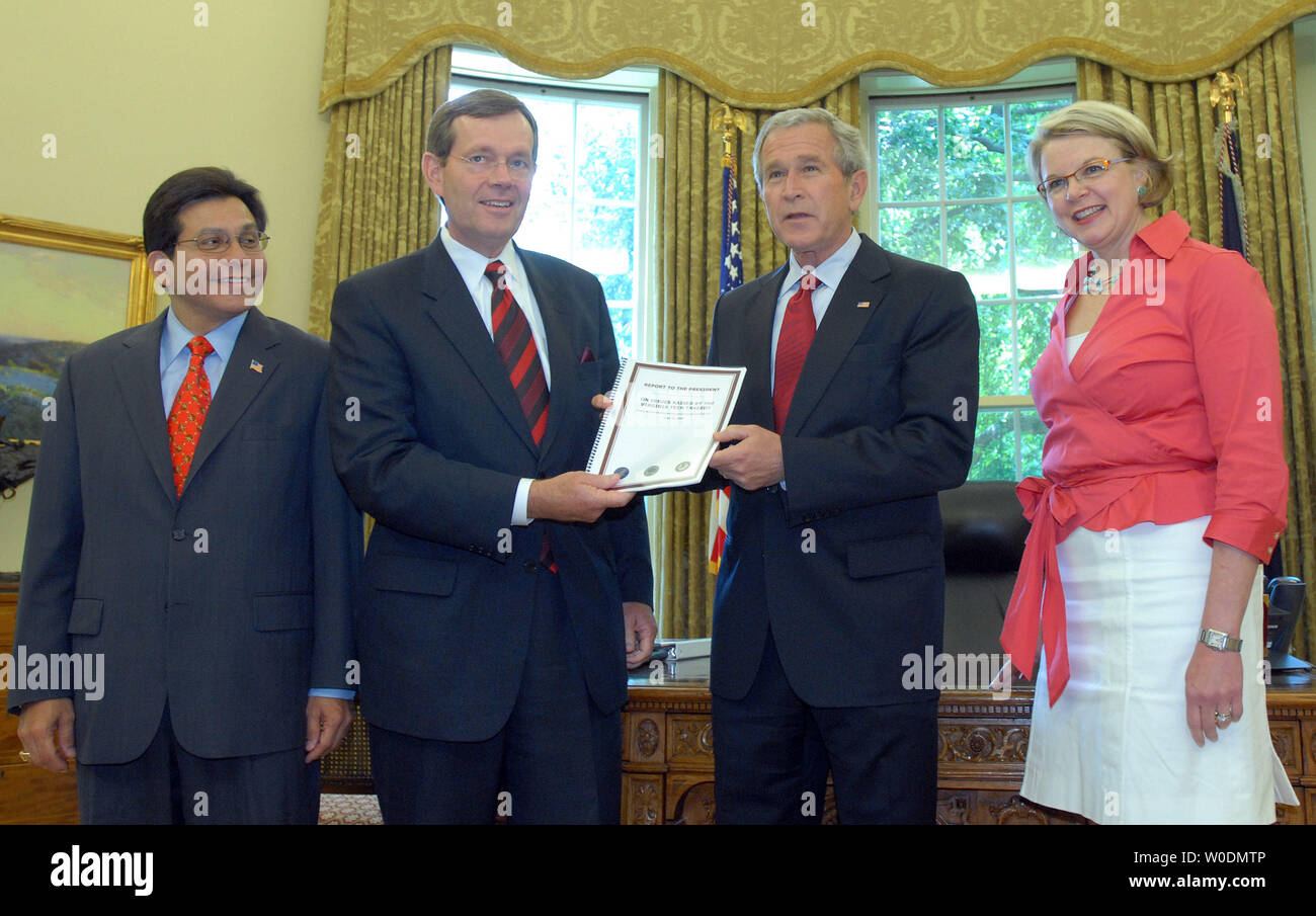Attorney General Alberto Gonzales, Secretary of Health and Human Services Michael O. Leavitt, U.S. President George W. Bush and Education Secretary Margaret Spellings (L to R) meet in the Oval Office of the White House to discuss the 'Report to the President on Issues Raised by the Virginia Tech Tragedy' in Washington on June 13, 2007. Bush and Leavitt are holding the report.  (UPI Photo/Roger L. Wollenberg) Stock Photo